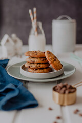 Chocolate chip cookies and white wooden background