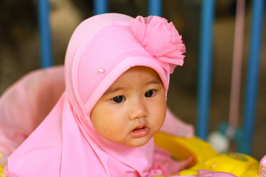 Little Girl Portrait Asian Baby Big Eyes And Red Cheeks Wearing Pink Hijab Baby Muslim Real-life Concept