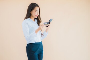 Portrait beautiful young business asian woman with phone and credit card