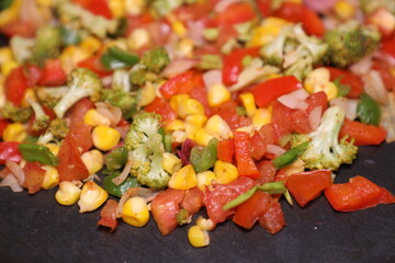 Vegetable Salad saute in Pan with Tomato Brocolli capsicum ready to be prepared for Khow Suey