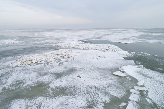 Aerial view of ice shove on the frozen lake Markermeer in winter, Netherlands