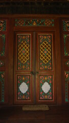 Fototapeta na wymiar Artistic Wooden Tribal Door of Resort Hotel