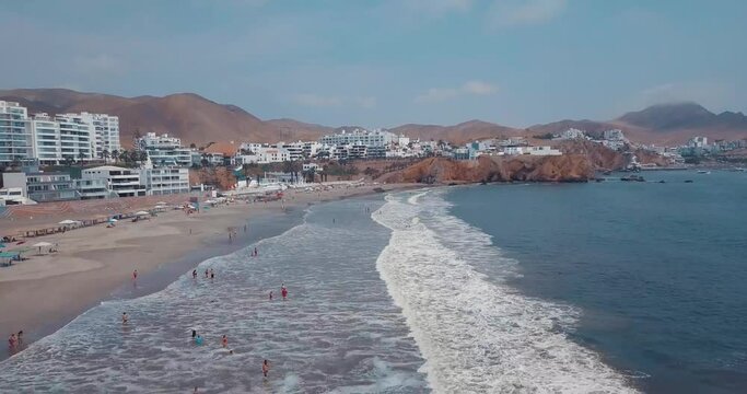 Aerial shot of the beach in Lima, Peru, in the middle of summer, before the 2020 pandemic