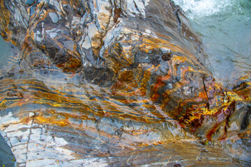 Close up view of rocks on the waters edge in Canada. Abstract, wall art, print. 