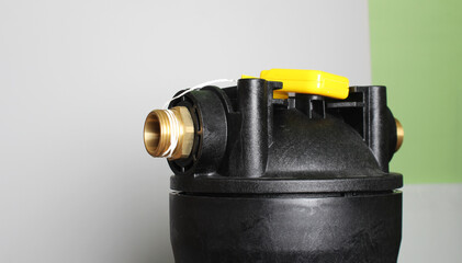 setting a water filter hand holding a blue flask on a light background