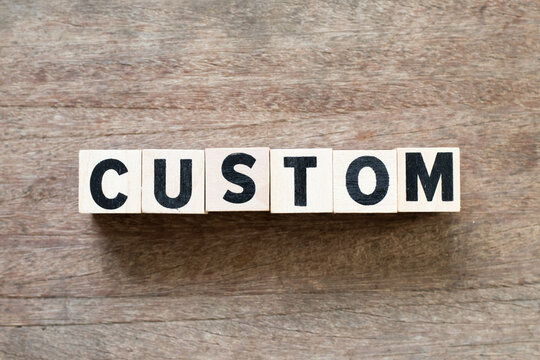 Alphabet letter block in word custom on wood background