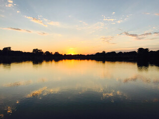 A sunset during an evening walk around a pond