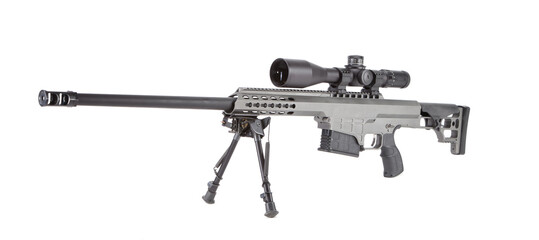 Metallic grey sniper rifle with magazine inserted, optic and bipod, ready to fire a long range shot.