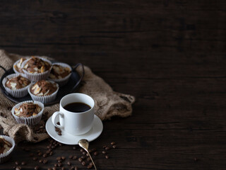 Coffee and Muffins Breakfast. Fresh Brewed Coffee with Muffins on Wooden Table with Copy Space. Rustic, still life of coffee and muffins.