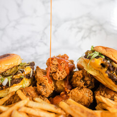 Bathing Wings and Burgers in Sauce