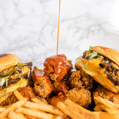 Hot Sauce Pouring Over Wings