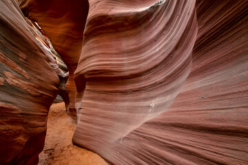Slot Canyons, commonly found in arid areas such as Utah, Arizona and southwest USA are formed by water erosion typically in sandstone and are at risk of flash flooding