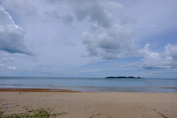 Bright beautiful seascape, sandy beach, clouds reflected in the water, natural minimalistic background and texture