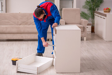 Young carpenter working indoors during pandemic disease