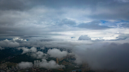 Aerial photography of China’s seaside second-tier cities under clouds and fog, and the...
