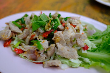 Pork with Lemon spicy-sweet sauce with chili and garlic mixed with sour lemon juice.