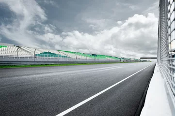 Poster Dramatic view of racing asphalt road and grand prix seat. © KahLoong