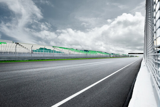 Dramatic view of racing asphalt road and grand prix seat.