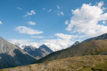 Picturesque Altai wilderness with Belukha mountain under cloudy blue sky in the background, Russian Federation, the Altai republic