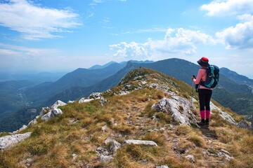 Fototapeta premium Senior woman hiking in Velebit mountain, Croatia