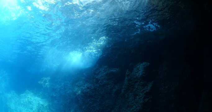 choppy water wavy sea underwater wavwe hit on rocks and makes foam on the surface of the sea ocean scenery