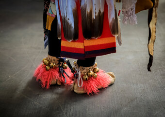 American Indian dancers in handmade intricate leather moccasins decorated with jingle bells at a powwow in San Francisco