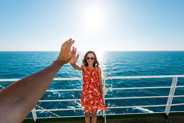 A woman is sailing on a cruise ship