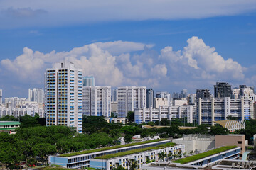 Fototapeta premium Architectural landscape of Toa Payoh central on a sunny day in Singapore. Common high rise public housing of HDB flats are painted in white and blue