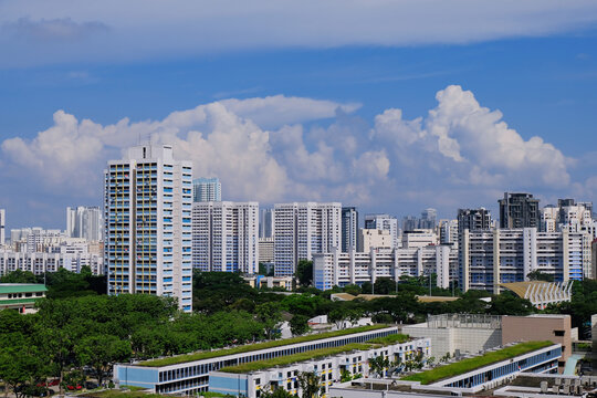 Architectural landscape of Toa Payoh central on a sunny day in Singapore. Common high rise public housing of HDB flats are painted in white and blue
