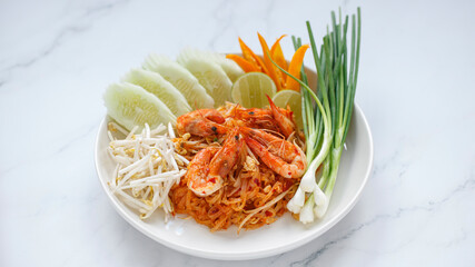 Pad Thai, Pud Thai stir fried noodle with shrimp served with mung bean sprout, cucumber, lime, chilli and spring onion