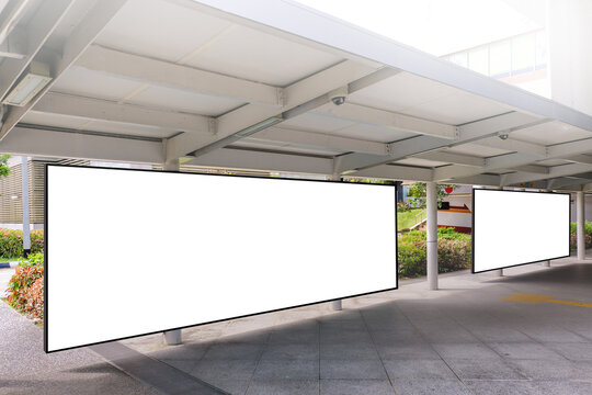 Edited Visual For Advertising Billboard Display At Pedestrian Walkway Of MRT Train Station. Blank Billboards Of Advertising Space For Mock Up Purpose; OOH Ad Placement