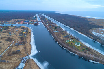 Over the ancient canals of the Mariinskaya Shipping System on a March day. Voronovo. Leningrad region, Russia