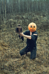 man in ragged clothes with a Halloween lantern . pumpkin Jack