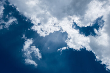 floating white cloud in bright blue sky in sunny day
