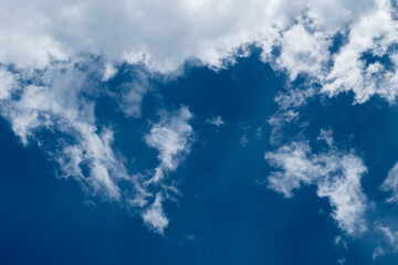 floating white cloud in bright blue sky in sunny day
