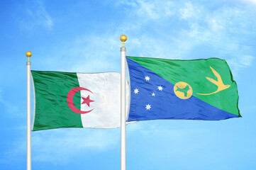 Algeria and Christmas Island two flags on flagpoles and blue sky