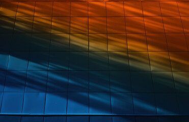 Diagonal shadows on orange blue wall background