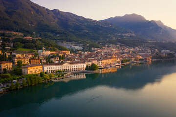 Fototapeta na wymiar Drone view of Lake Iseo at sunrise, on the left the city of lovere which runs along the lake,Bergamo Italy.