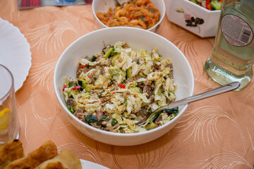salads in dishes on the kitchen table