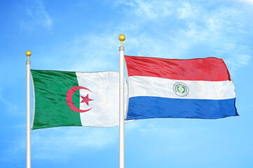 Algeria and Paraguay two flags on flagpoles and blue sky