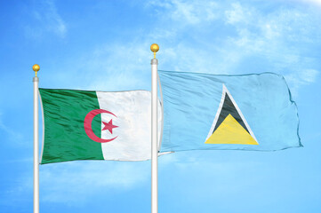Algeria and Saint Lucia two flags on flagpoles and blue sky