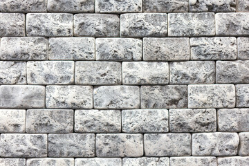 Seamless texture of white decorative stacked stone, natural stone cladding. brick background. close up. Background