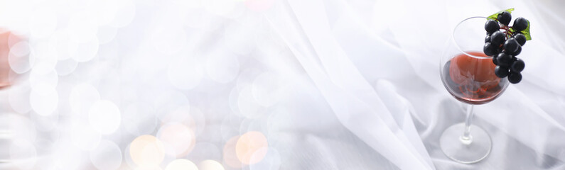 Glass with grape red semi-dry wine. Valentine's day concept background. Gift for the holiday. Sweet sparkling wine.