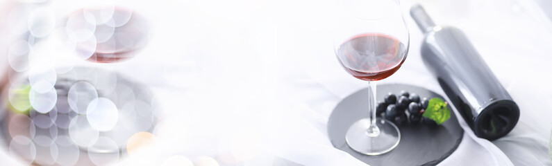 Glass with grape red semi-dry wine. Valentine's day concept background. Gift for the holiday. Sweet sparkling wine.