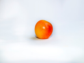 yellow berry with a red tint