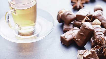 Chocolate bars on a black background in backlight. Chocolate with filling. Sweet sweets for snack and tea.