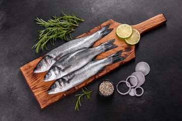 Fresh fish seabass and ingredients for cooking. Raw fish seabass