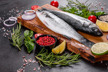 Fresh fish seabass and ingredients for cooking. Raw fish seabass