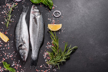 Fresh fish seabass and ingredients for cooking. Raw fish seabass