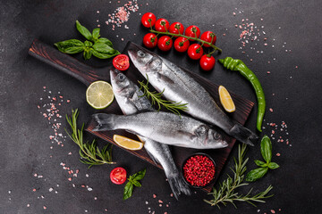 Fresh fish seabass and ingredients for cooking. Raw fish seabass